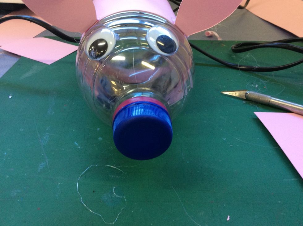 Get some Googly eyes and hit glue it to the bottle.