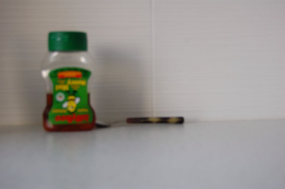 Get some honey and a teaspoon.