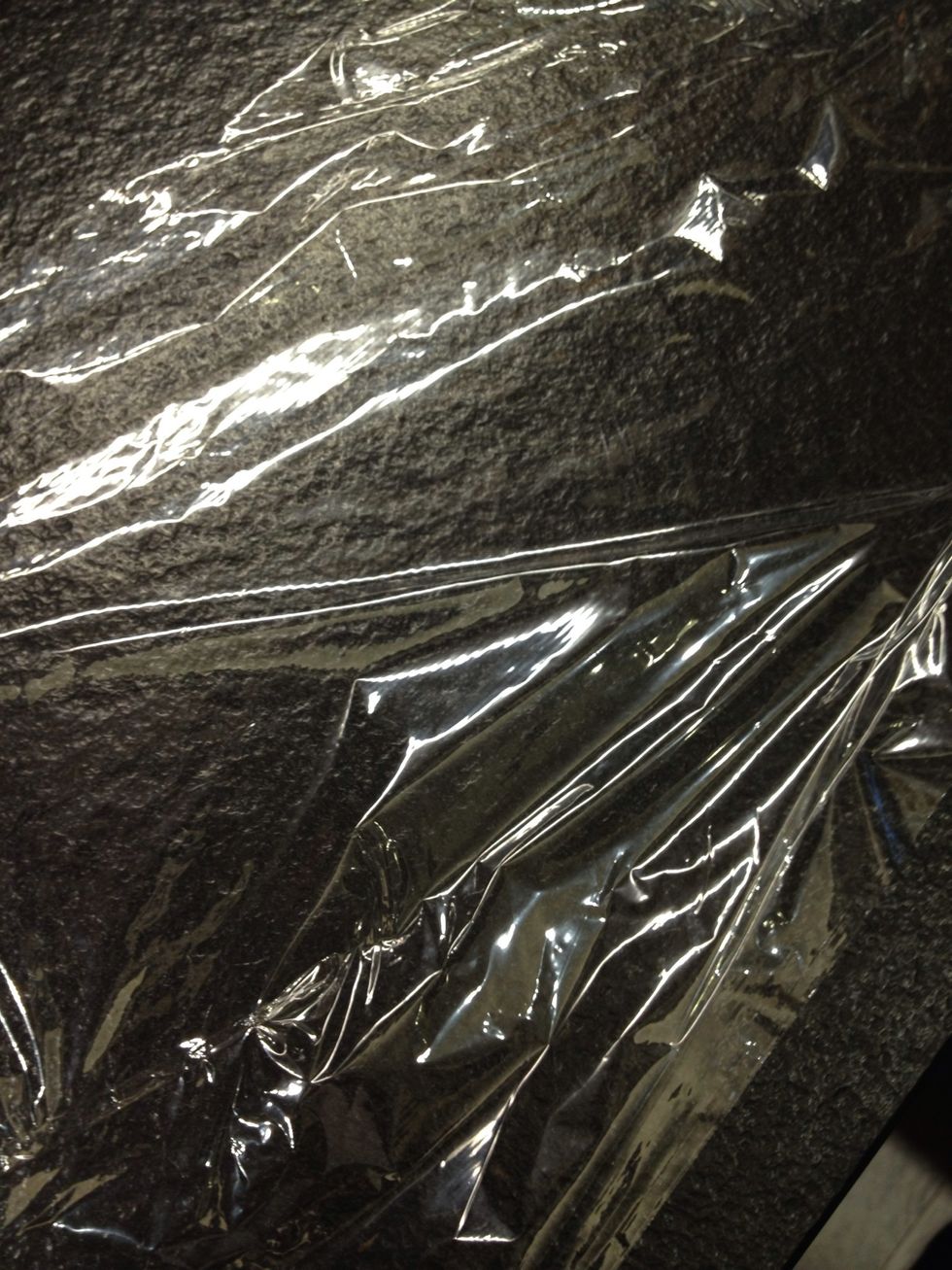 Get some plastic wrap and layer it on a surface