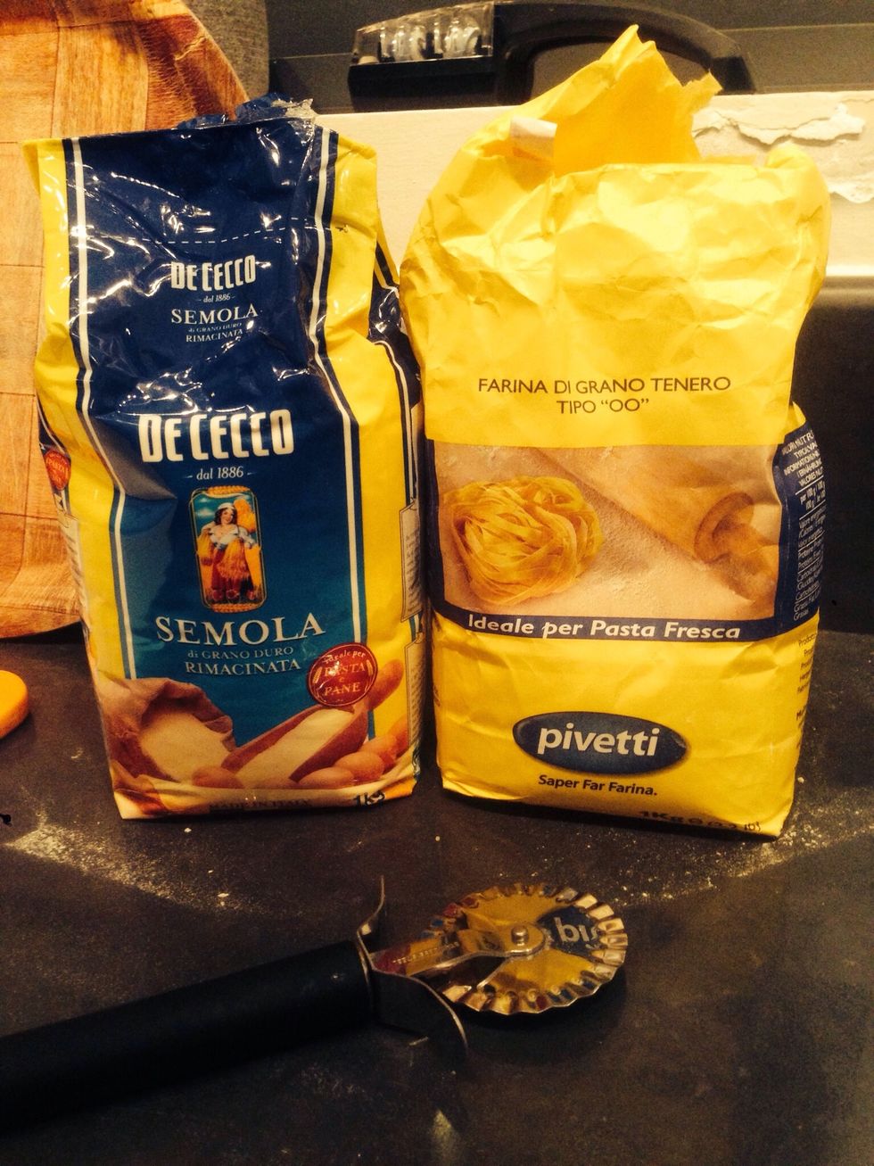 Get some real Italian Tipo 00 flour, if you can't find any use regular flour. Optionally, get Semola flour for use on the kitchen counter. You can use flour instead.