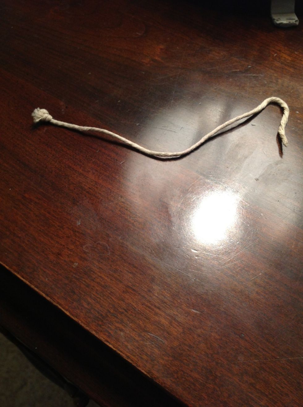 Get some strong string. It has to be breakable though, in case your horse happens to get stuck on something. No elastic string!! Cut about 7 inches, depending on your horse's mane length.