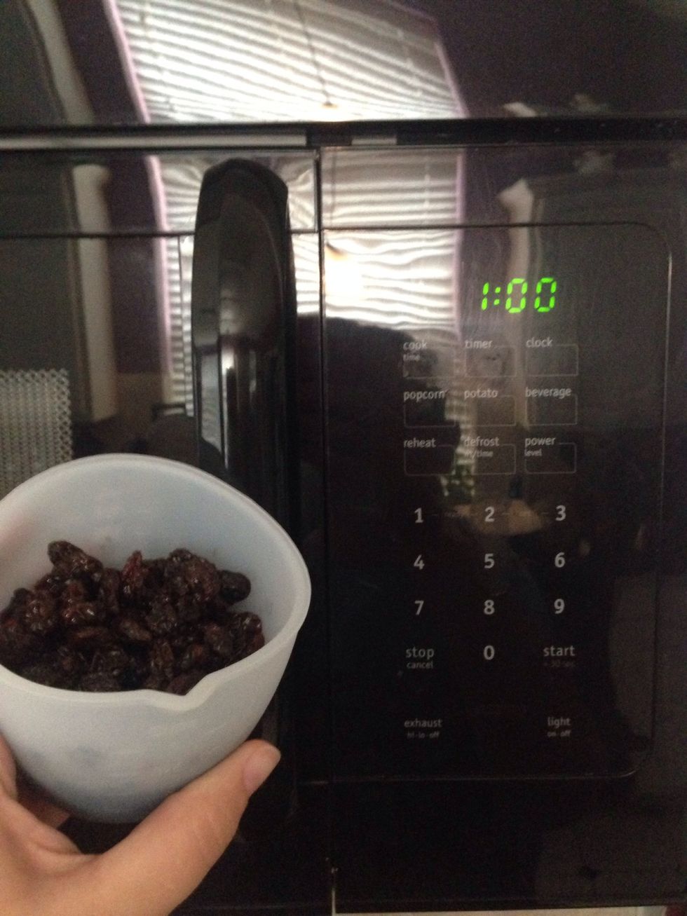 Get started by taking 2 Tablespoon worth of dark rum & add to the 3/4 cup raisins. Microwave for 1 minute on high. Then let set/cool.