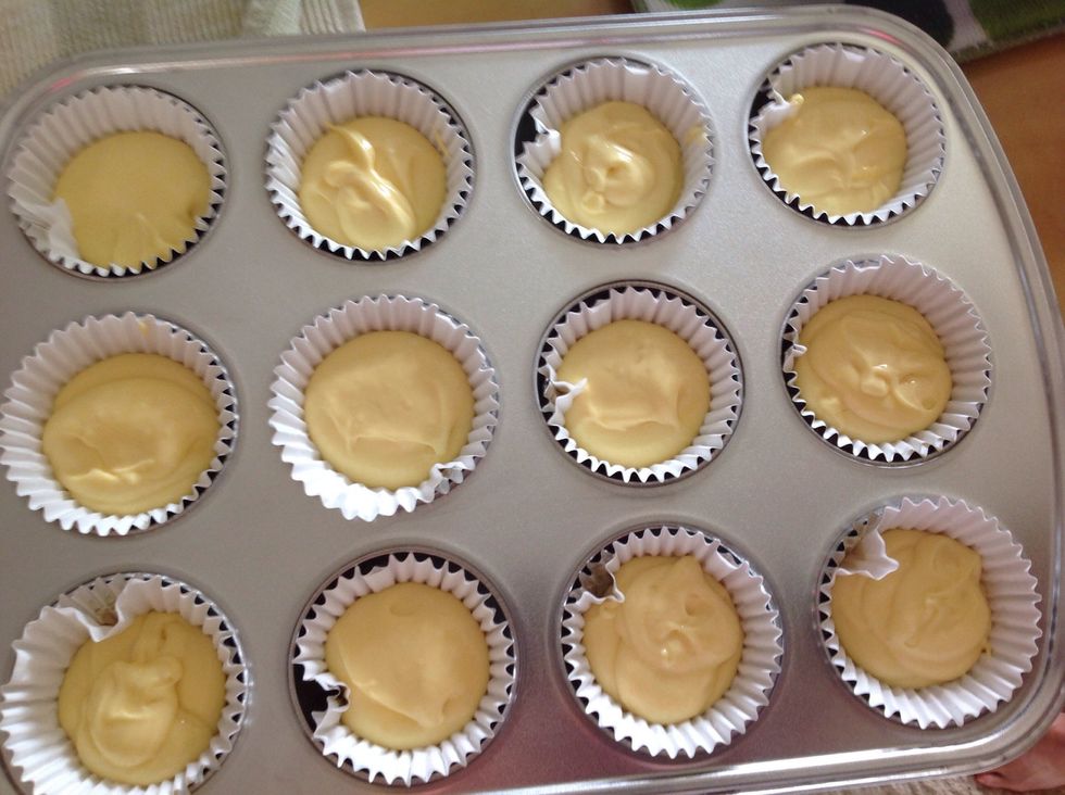 Get the batter and fill the cupcake liners about a little over half way.