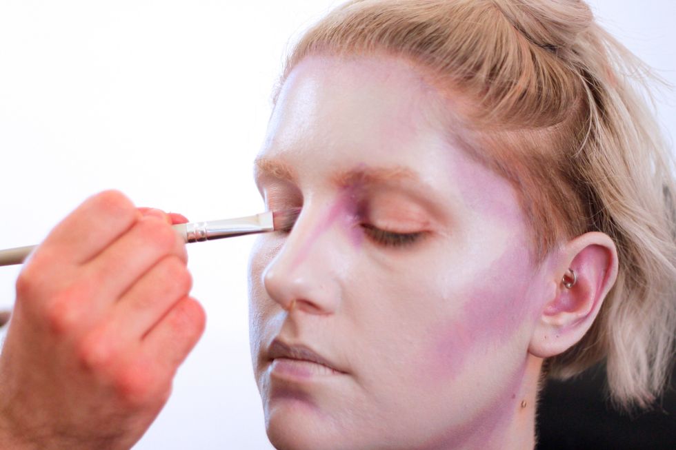 Get the contours of the eyes to make them appear sunken.
