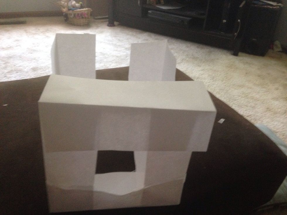 Get the last for pieces of paper and...put the piece up top then tape (repeat 4 times )