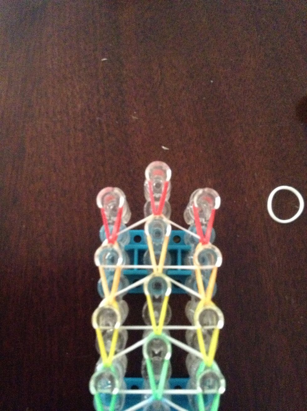 Get the left and right red and put it on the middle peg