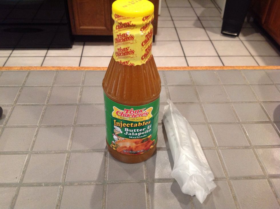 Get the marinade you will be using and fill the syringe. We used Tony Chachere's Butter & Jalape\u00f1o Marinade. It is NOT hot at all once the turkey is smoked! It is just VERY moist and tasty!