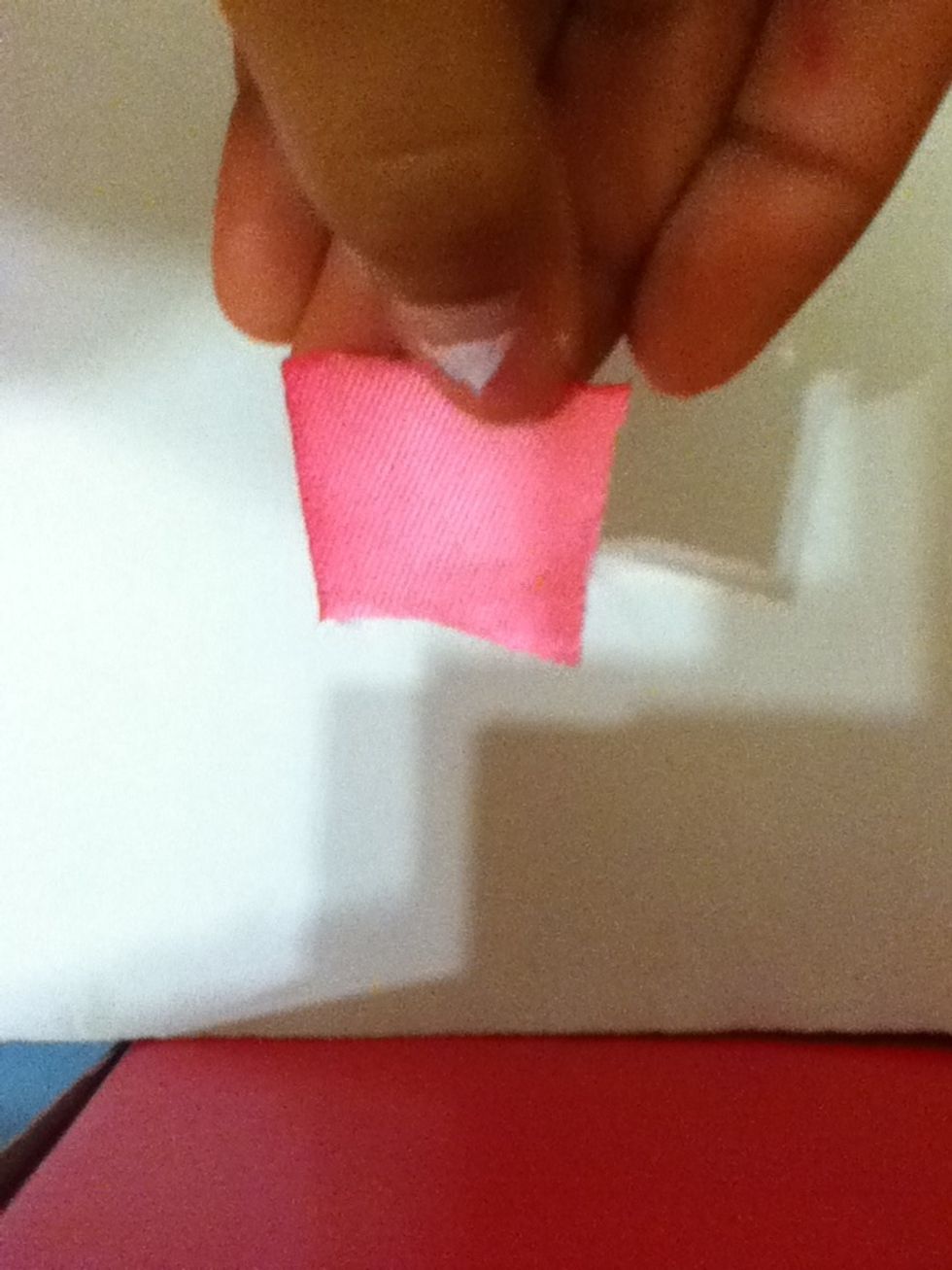 Get the other small peice and cover it to hold the hair band in place