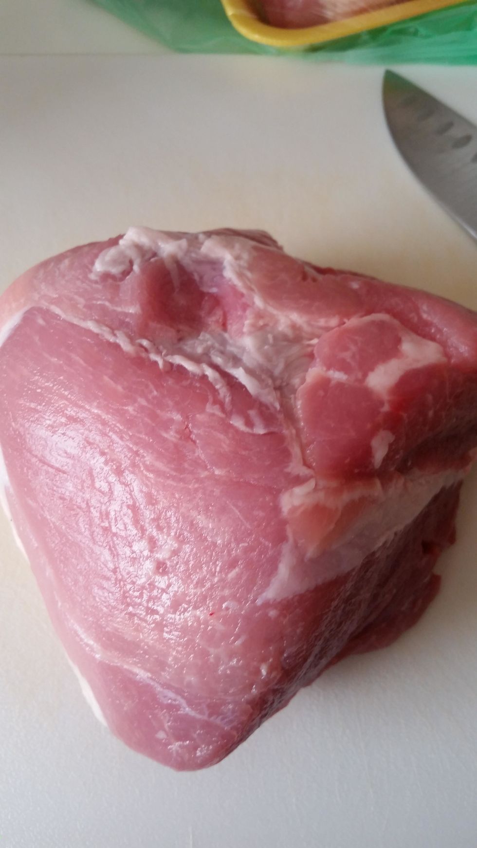 Get the pork out of the package and cut it into bite size chunks.