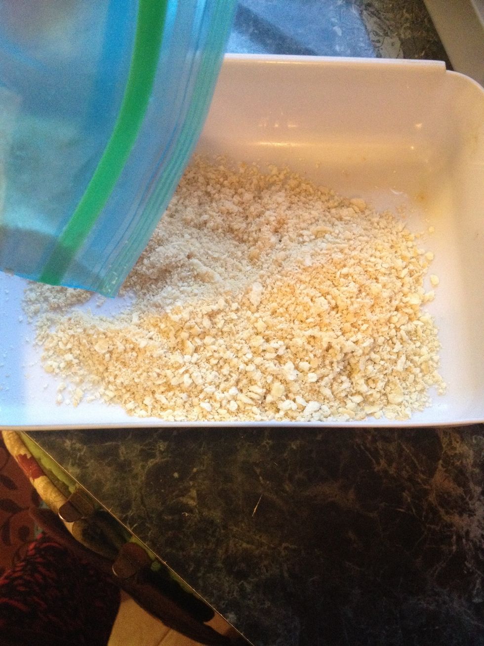 Get the second bowl and add the saltine cracker crumbs to it.