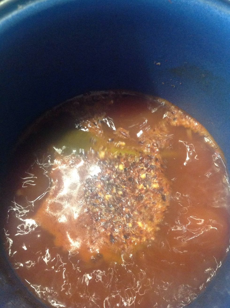 Get the shrimp stock, let it boil, add chipotle, ketchup, crushed red pepper, vinegar and the sugar, it's almost like the marinade,