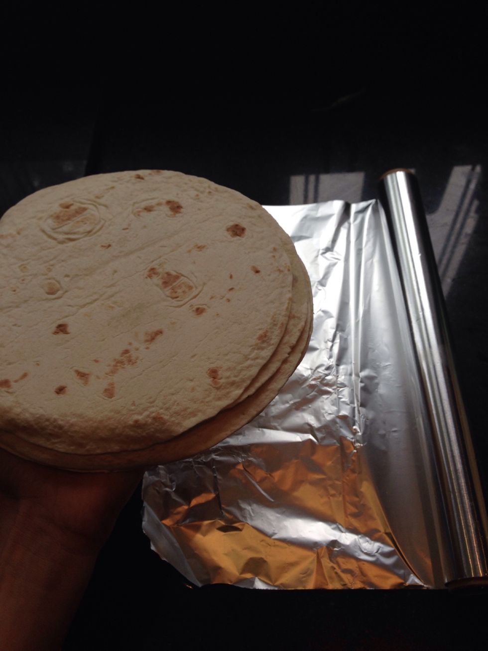 Get the tortillas and wrap them in foil