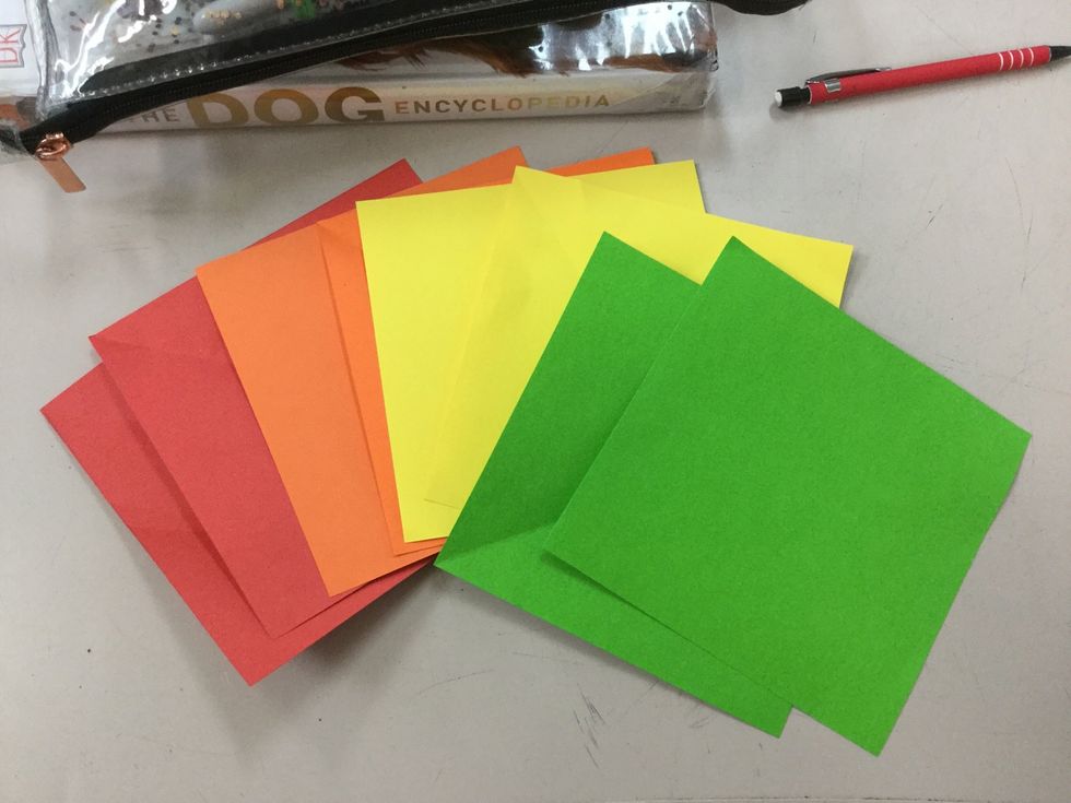 Get the two red origami paper in front of you