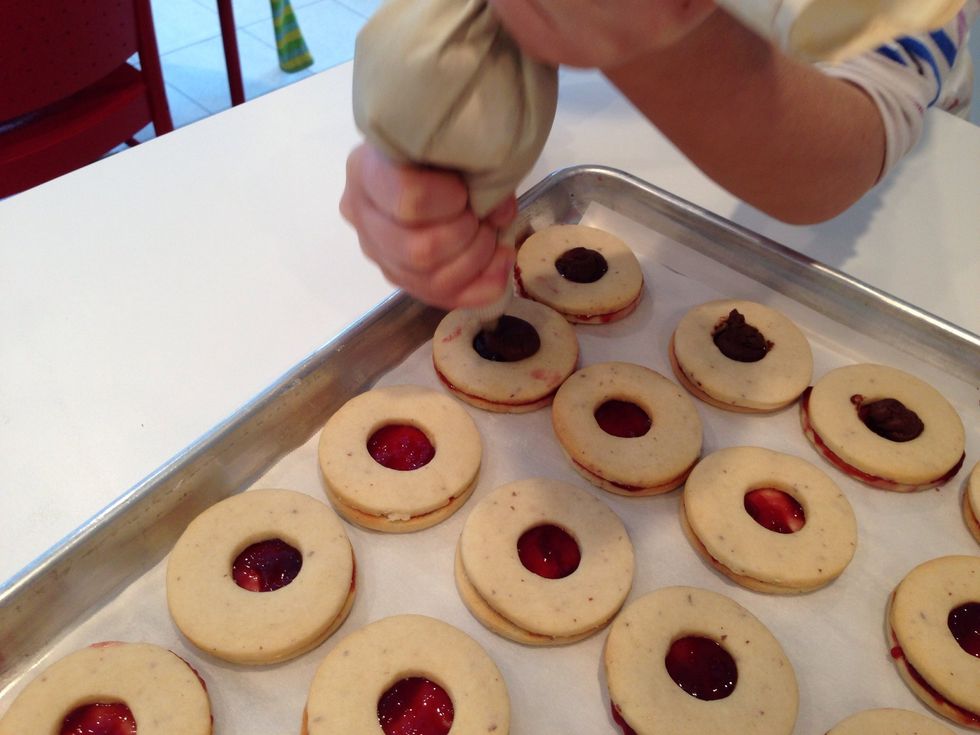 Get those pastry bags out of the glasses and start filling the holes, comme ca. Aren't they beautiful?