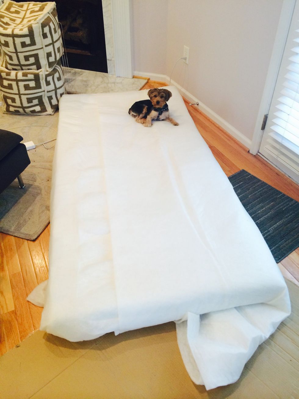 Get twin mattress toppers to fit your size. For this project, I used two twin size mattress toppers. Cover them up with batting fabric for a smoother appearance