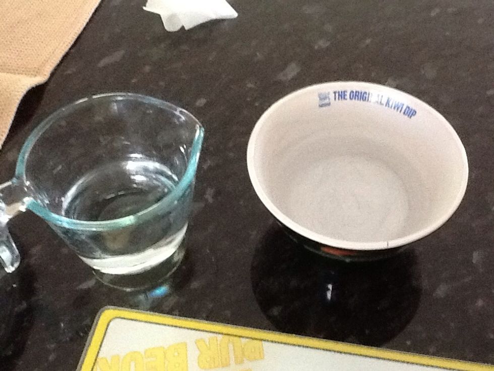 Get two bowls and fill with water. One will be for your hands to stop rice sticking to them, and the other is to wet the seaweed at the end, so it closes.