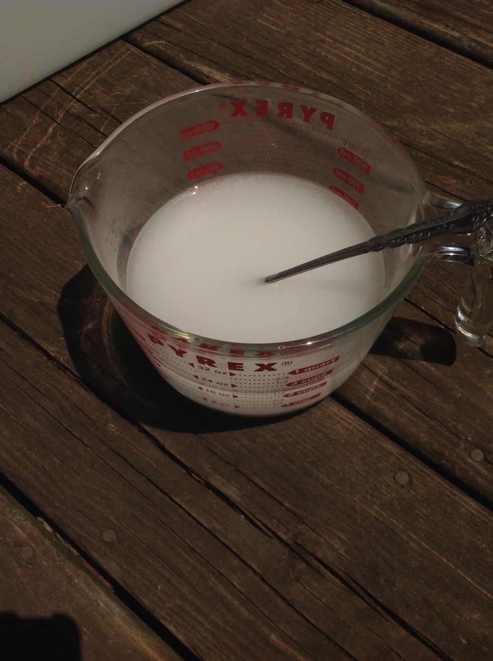 Get two cups of hot water & sprinkle in the soda ash