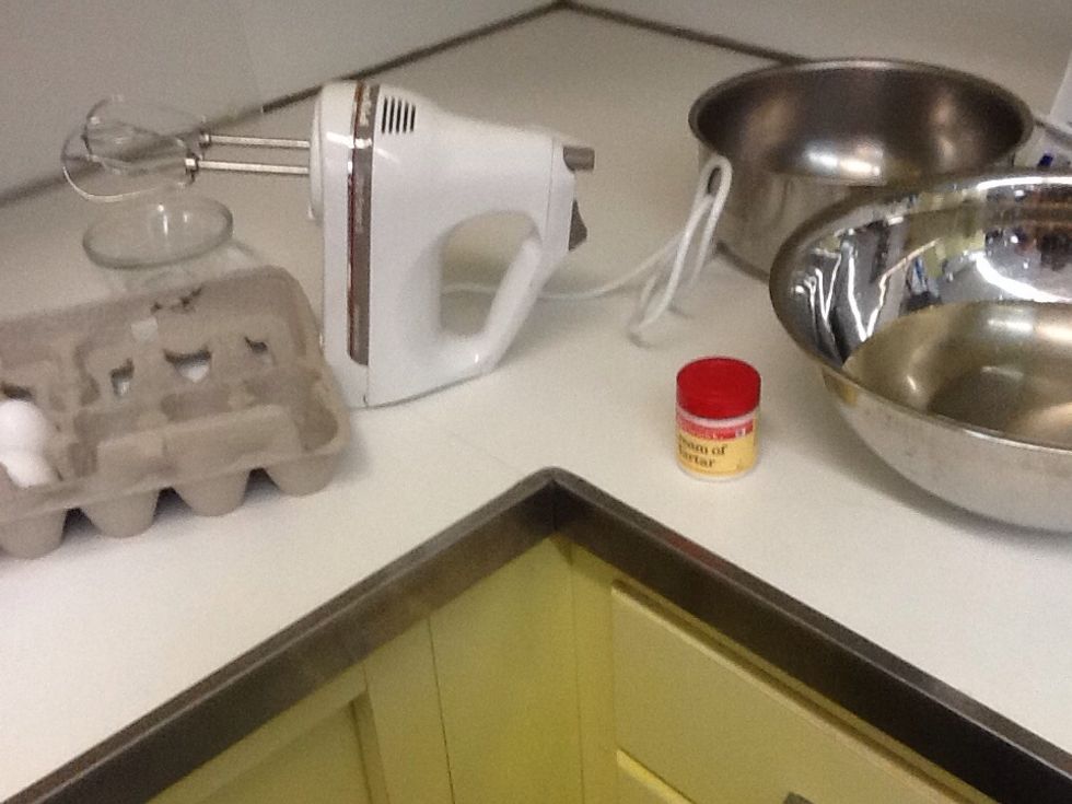 Get two eggs and cream of tartar as ingredients.