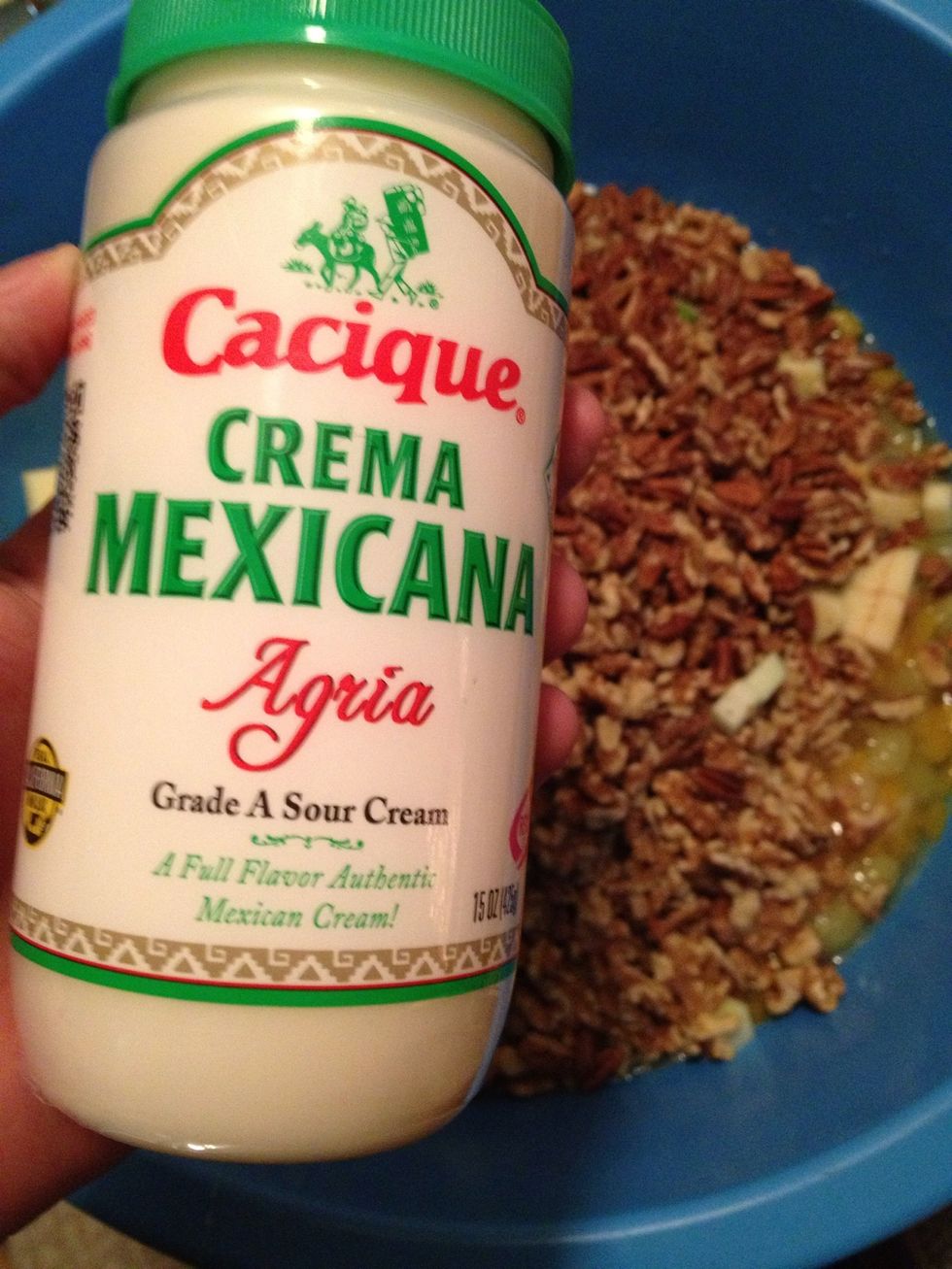 Get two of these Mexican sour cream things and add them into the bowl.
