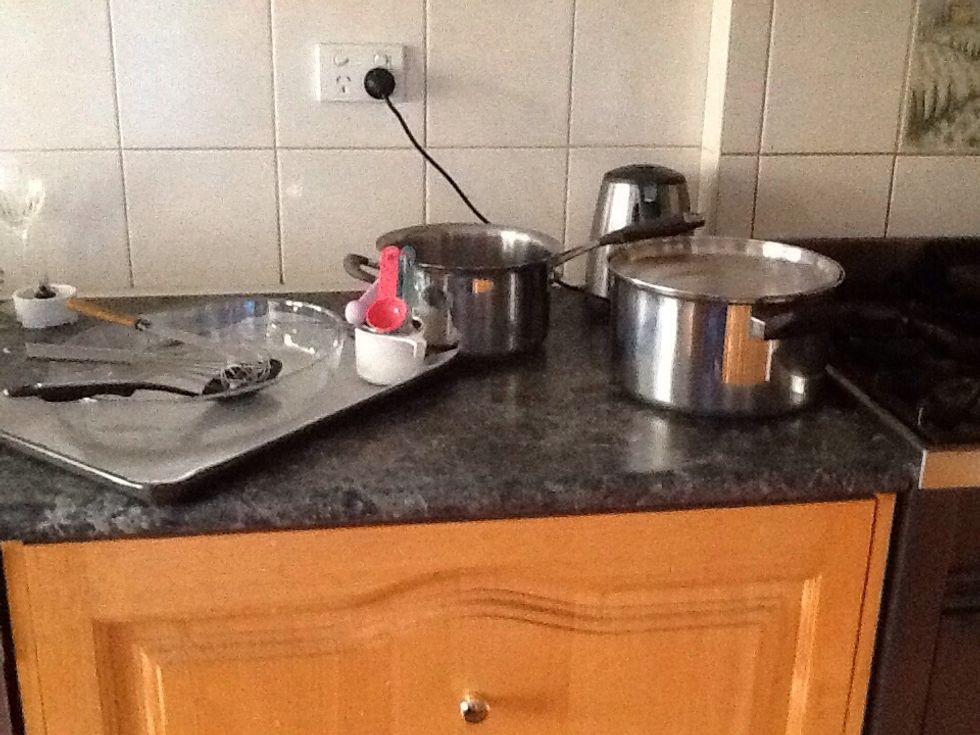 Get utensils out and ready (boiler pot, large pot, oven proof dish, oven tray, measuring cup, measuring Spoons, whisk and stering spoons)