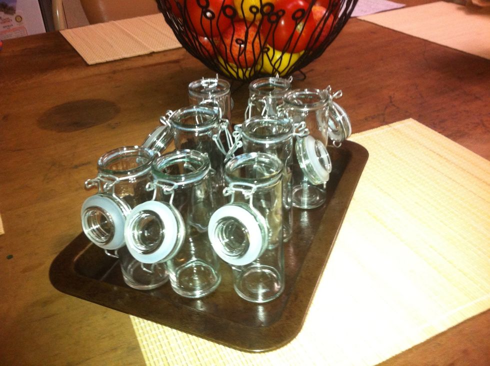 Get whatever jars or bottles you want to use and put them on an oven tray. Stick them into your preheated oven while you're heating the sauce, it will sterilise them and help them seal