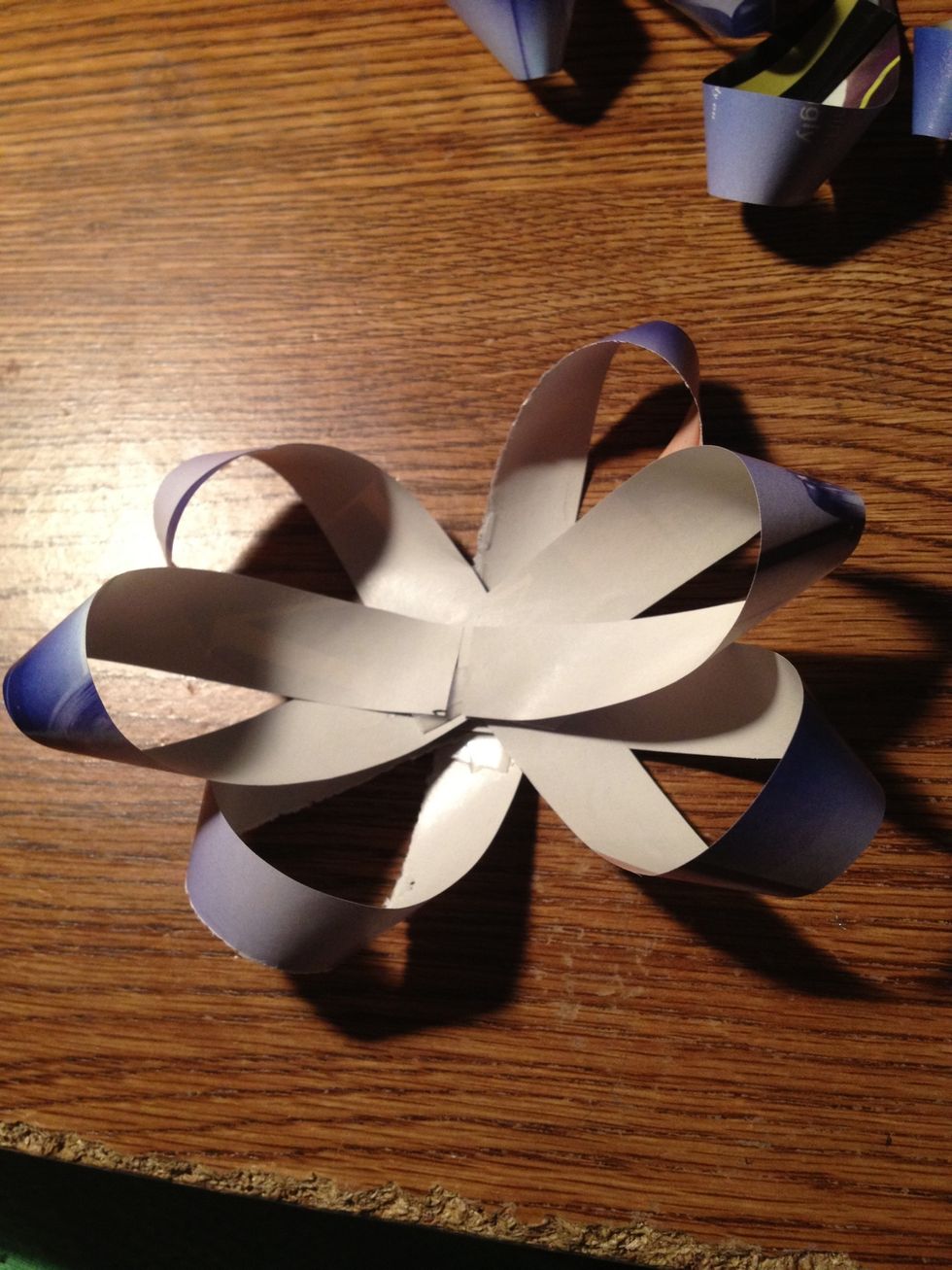 Get you first three, the biggest ones, and put them together like this. Tape the centers, so they'll be stuck together.
