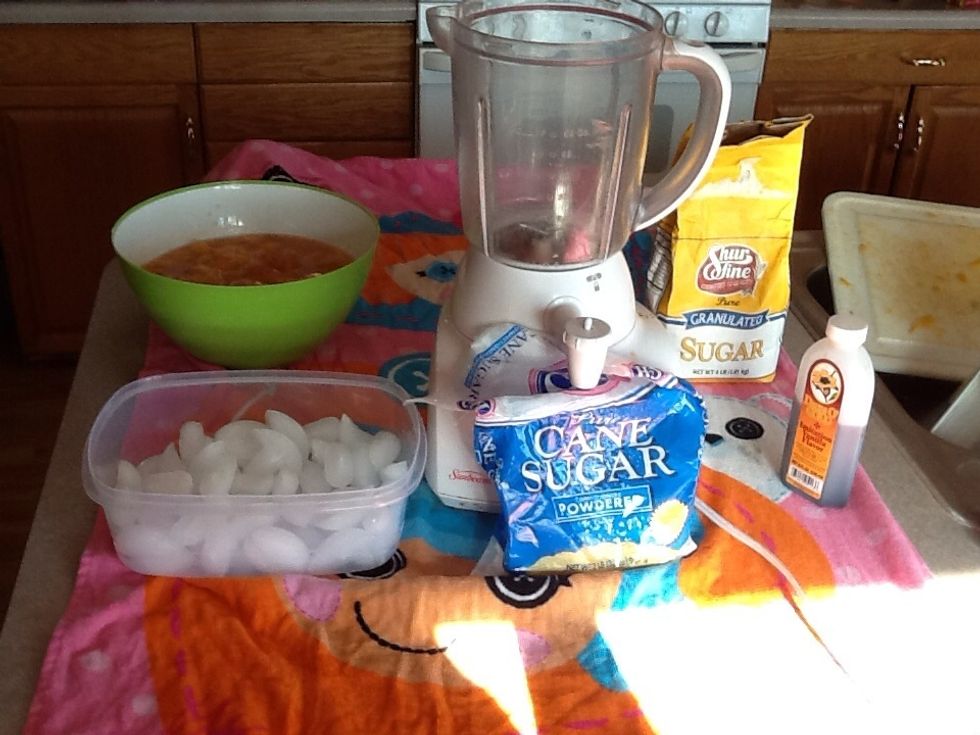 Get you ingredients bunch of ice cubes, peaches, sugar, and blender no powdered sugar grabbed the wrong one opps!! Put a towel down because it gets messy!!!
