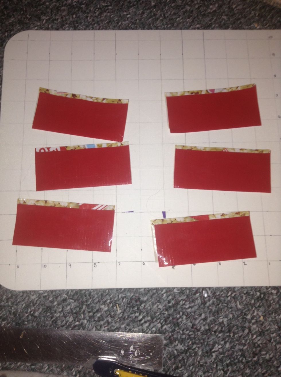 Get your 6 pieces back, and fold over the tape that was still sticky. (It's the same thing as the bigger panels but they are smaller)