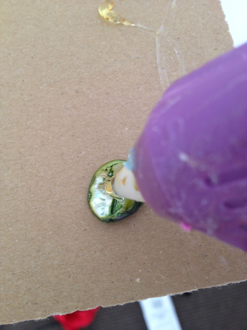 get your beads ready and put a tiny dab of glue on the back of one.