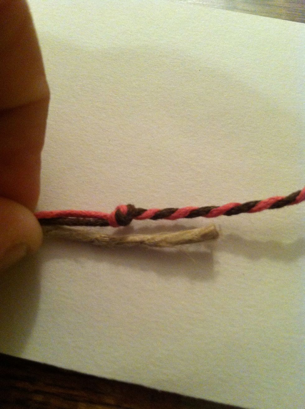 Get your center cord, line it up with your second knot leaving about 1/4in tail. You could also add it to the knot but it's kind of difficult and won't make a huge difference.