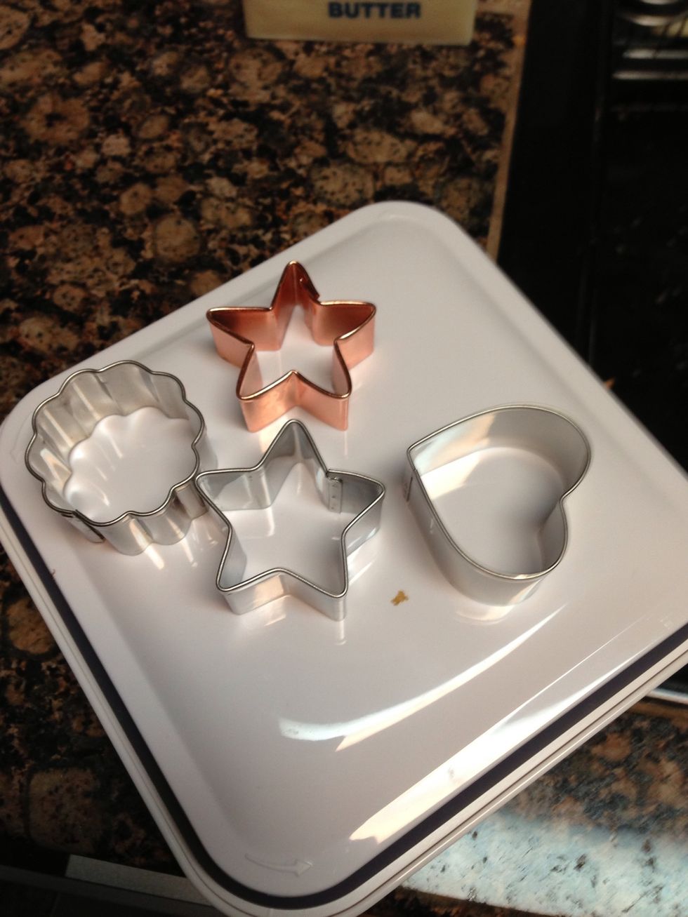 Get your cookie cutters. Preheat oven