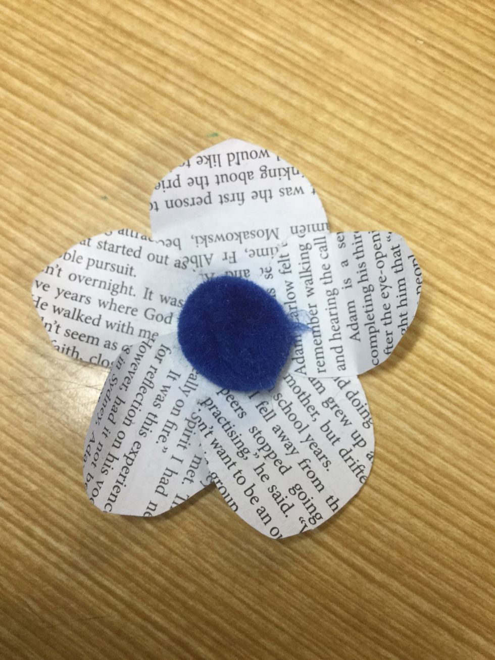 Get your cotton ball and glue it in the centre of the flower.