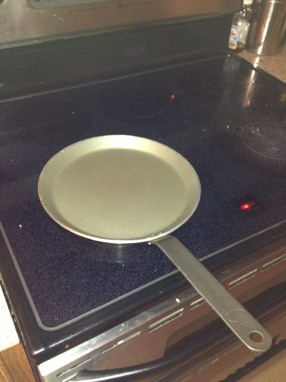 Get your crepe pan on the burner and turn it on to medium. Do not go past medium as it will warp the bottom of the pan. I am on my second one because of it.