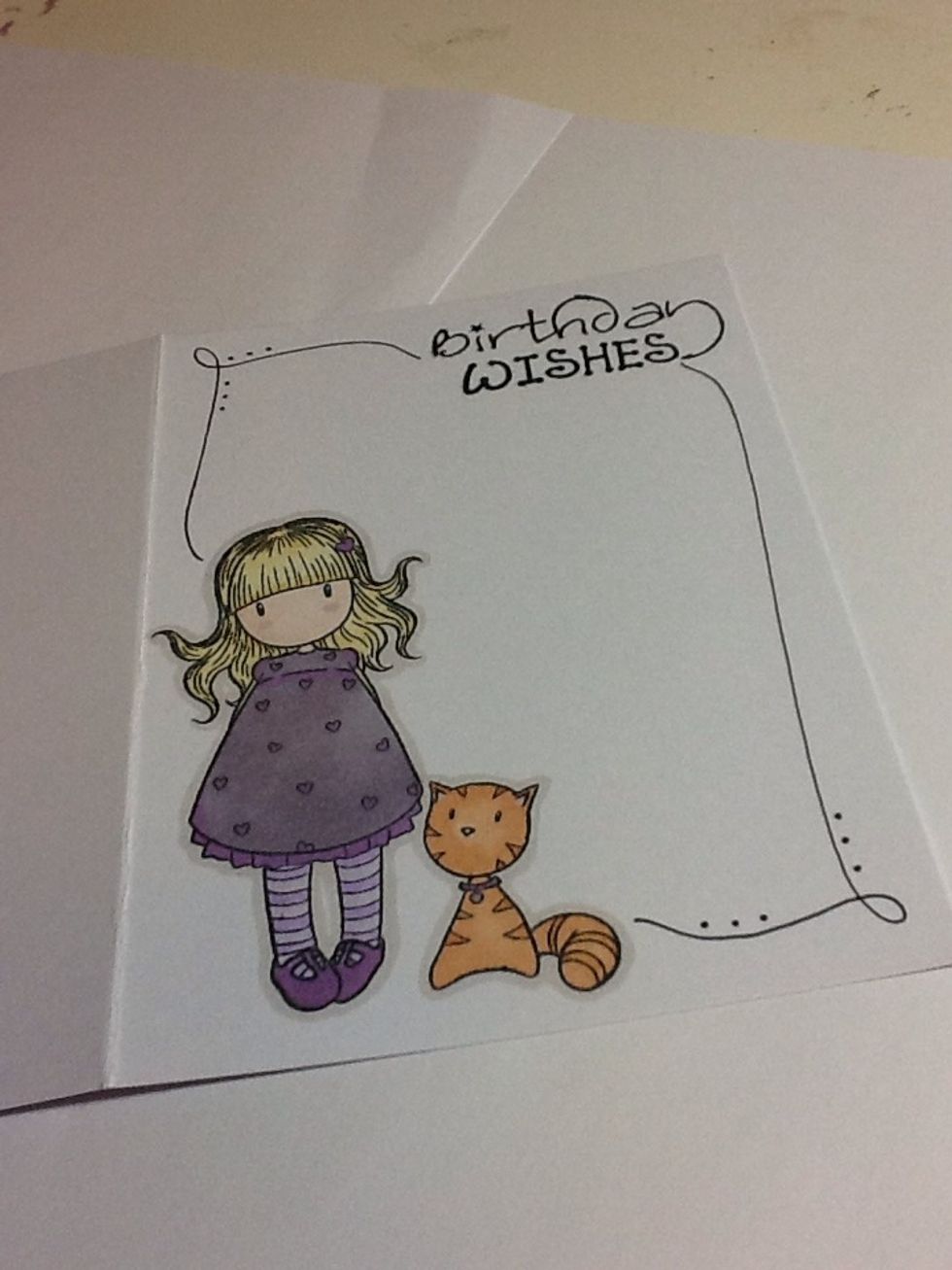 Get your fine liner, this will take a steady hand so practise on scrap paper first. But draw a simple border around the edge of the card and joining the image with the greeting but not touching