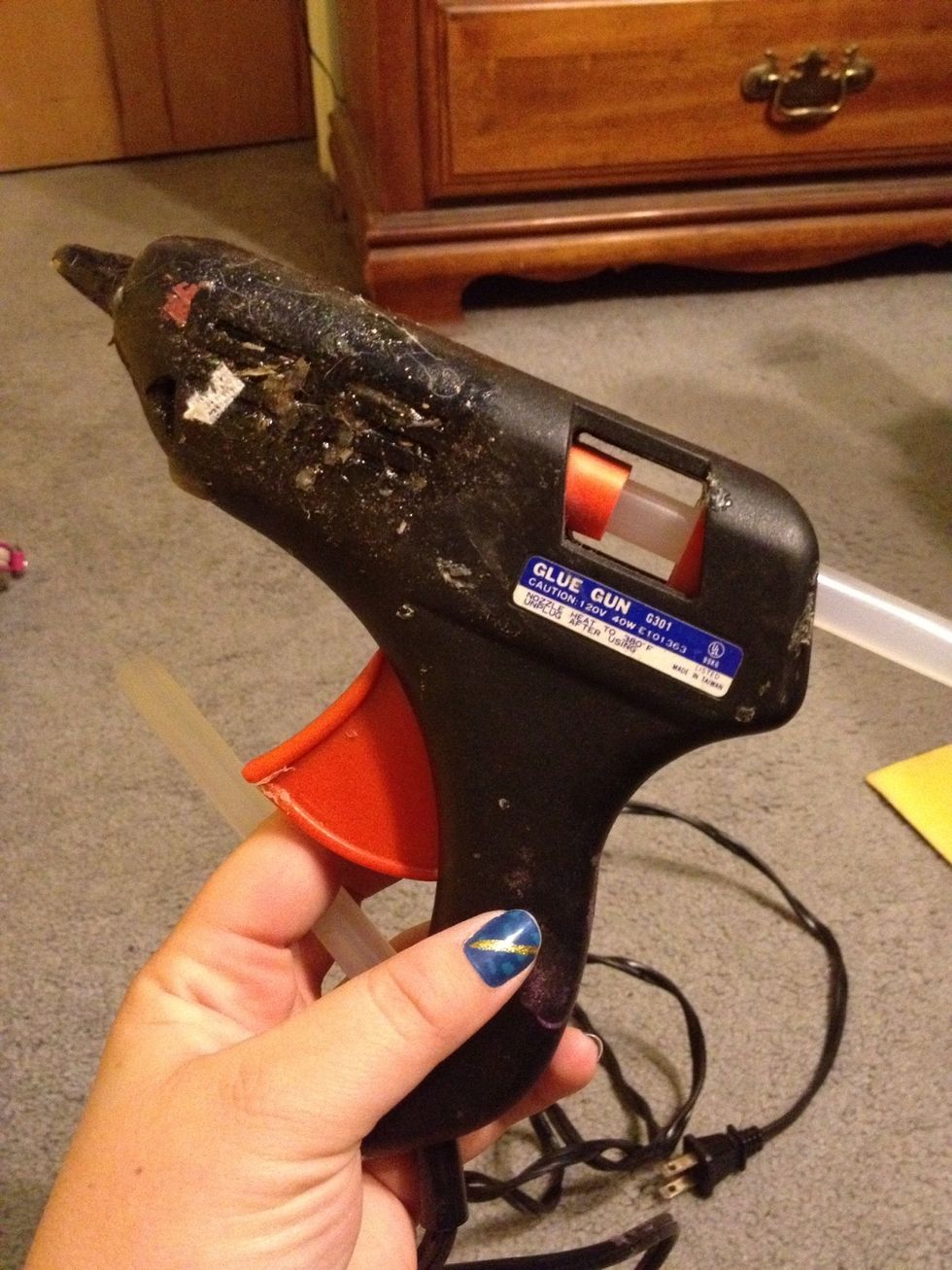 Get your hot glue gun out and start warming it up..BE CAREFUL!