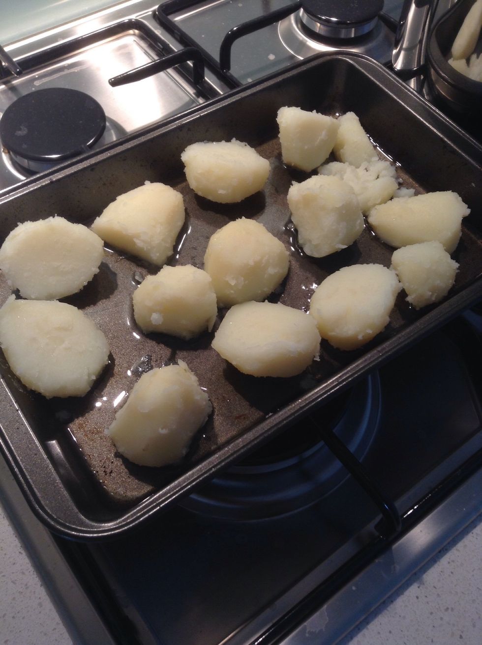 Get your hot oil out the oven and put your potatoes onto the tray