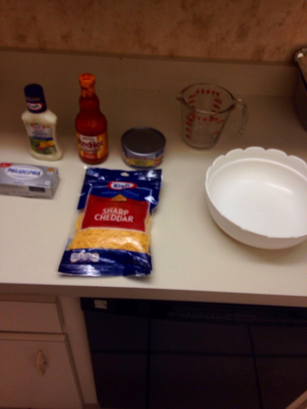 get your hot sauce , chicken , ranch , cream cheese , shredded cheese , bowl and measuring cup all set up ready . preheat your oven to 350 degrees