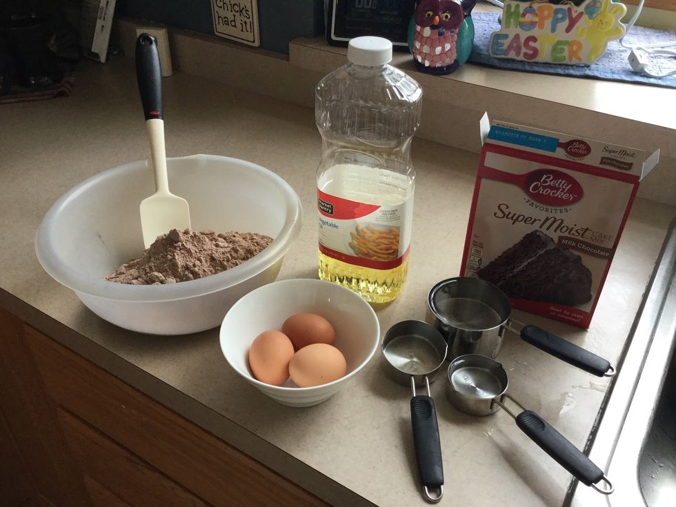 Get your ingredients,eggs,cupcake mix,water,vegetable oil,bowl,and a spatula