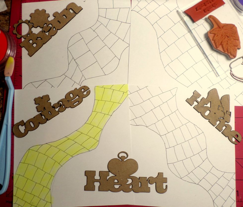 Get your inside pages ready for the Pan Pastels.  I drew a "brick road" on my pages with a black marker. Then, I colored it yellow with the Pan Pastels.  I used Pan Pastels on the chipboard words too.