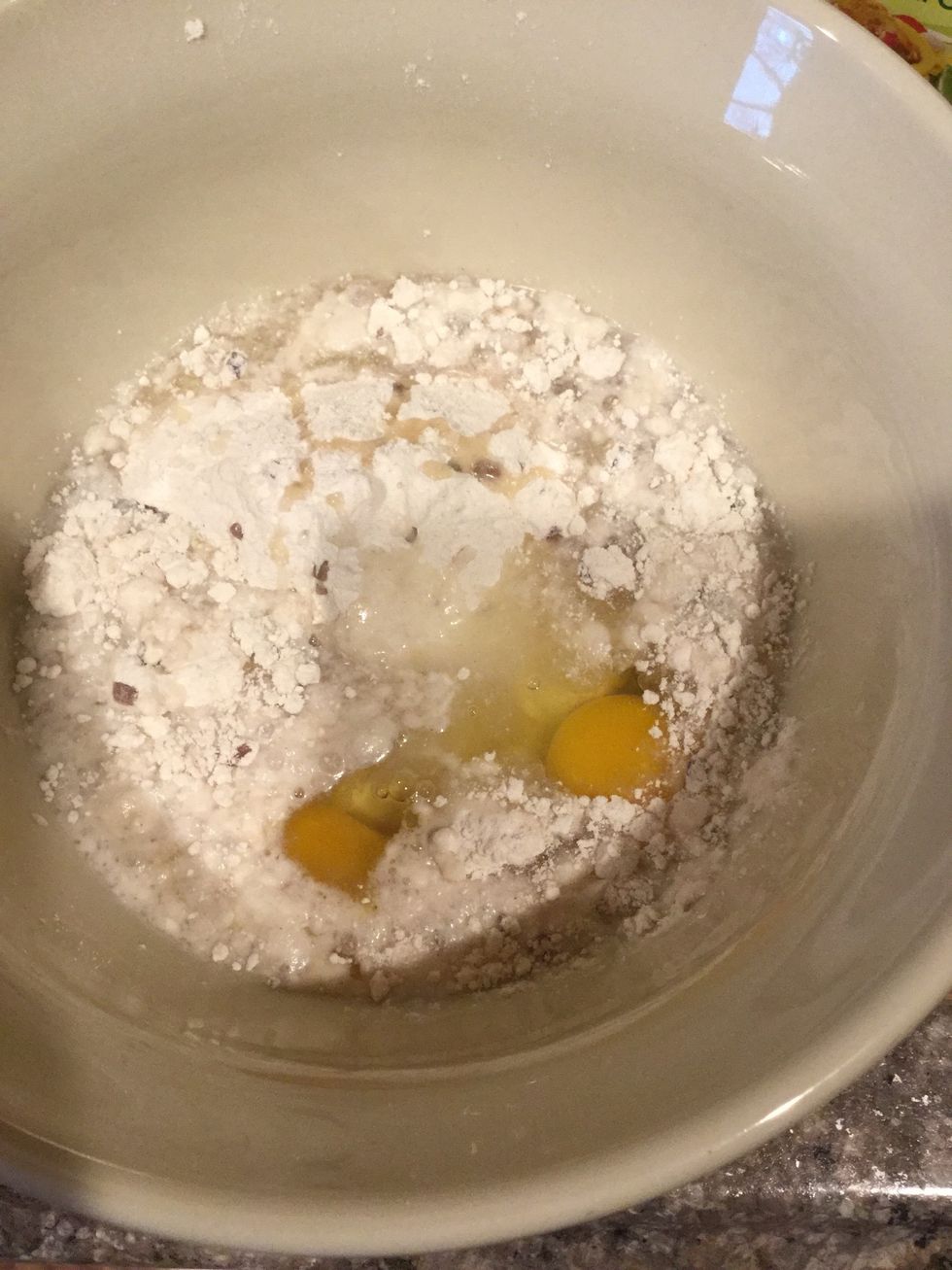 Get your mix, vegetable oil, two eggs and water. Put those ingredients in one mixing bowl.