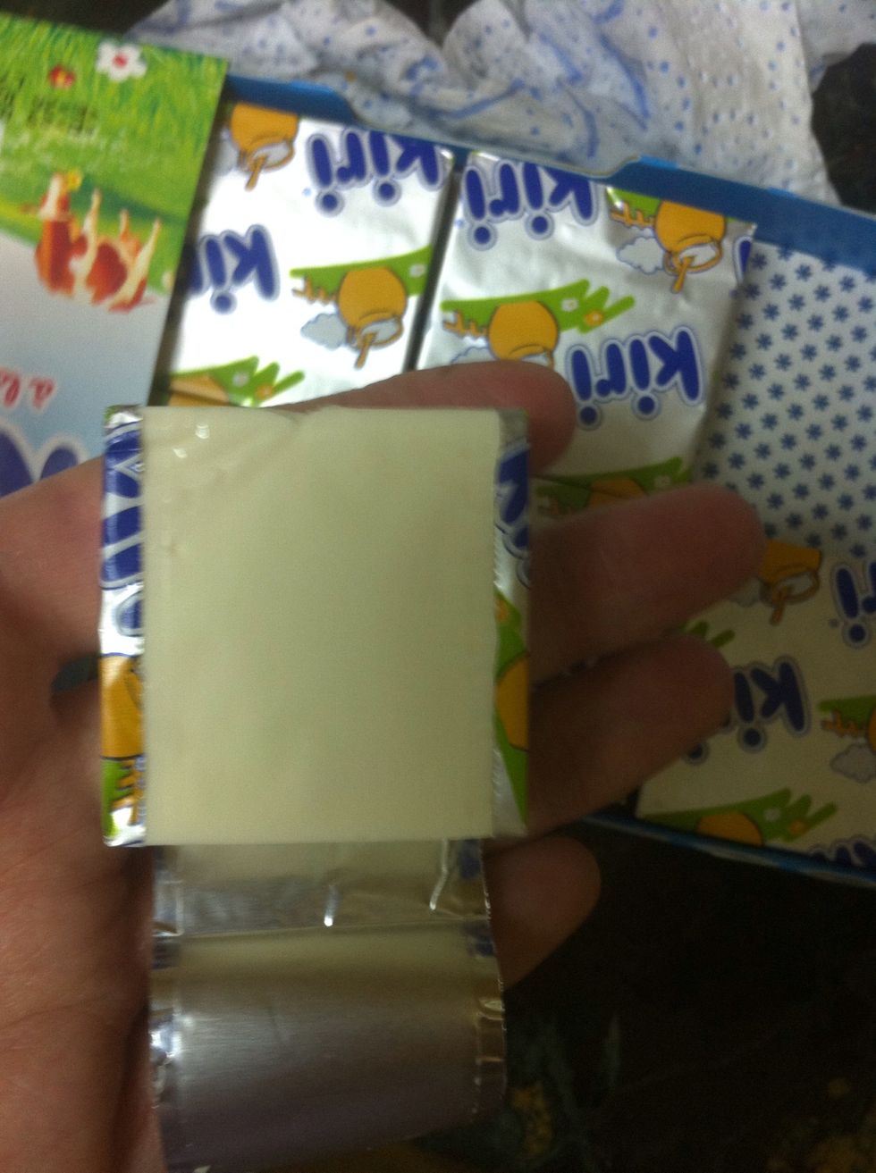 get your mixer ready and start adding the second layer ingredients first add the cream cheese if it comes in cubes like this you will need 20 cube
