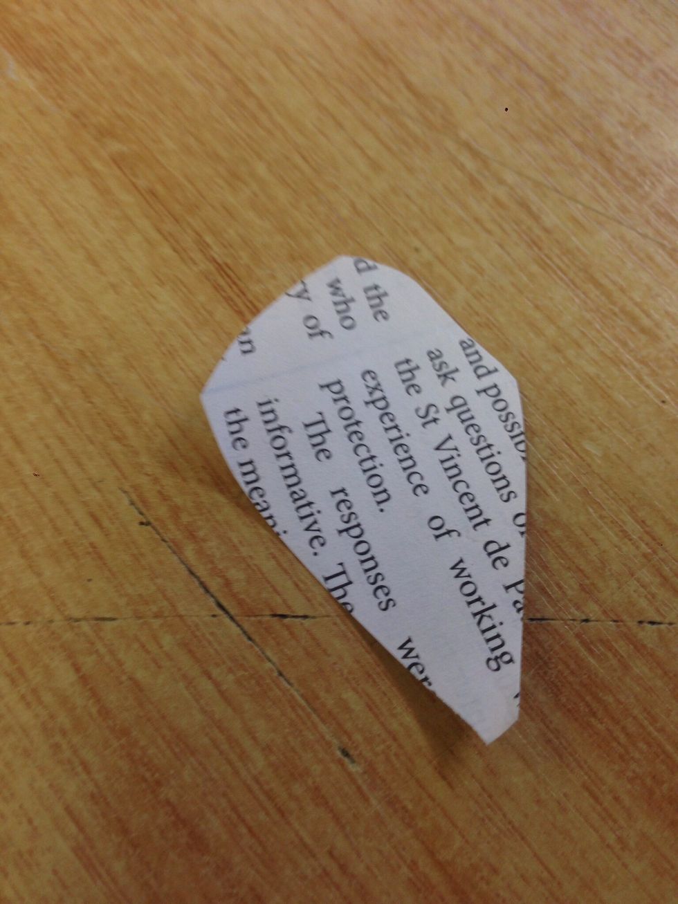 Get your newspaper and cut out 5 pieces of paper in the shape of flower petals