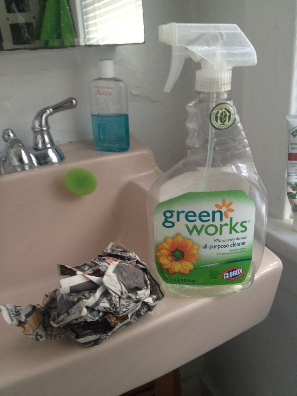 Get your piece of old newspaper, you can reuse it as many times you want, and your cleaning product.