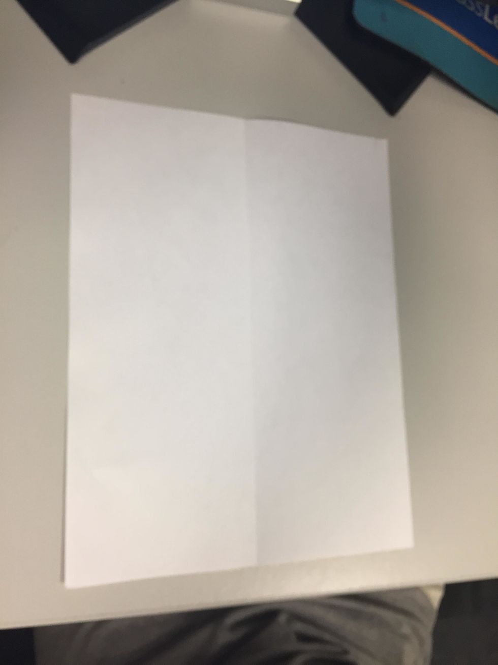 Get your piece of paper and fold it horizontally.
