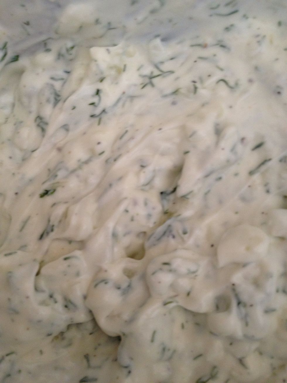 Get your sour cream, mayo and Greek yogurt mix away. Add your salt, garlic , onions and dill