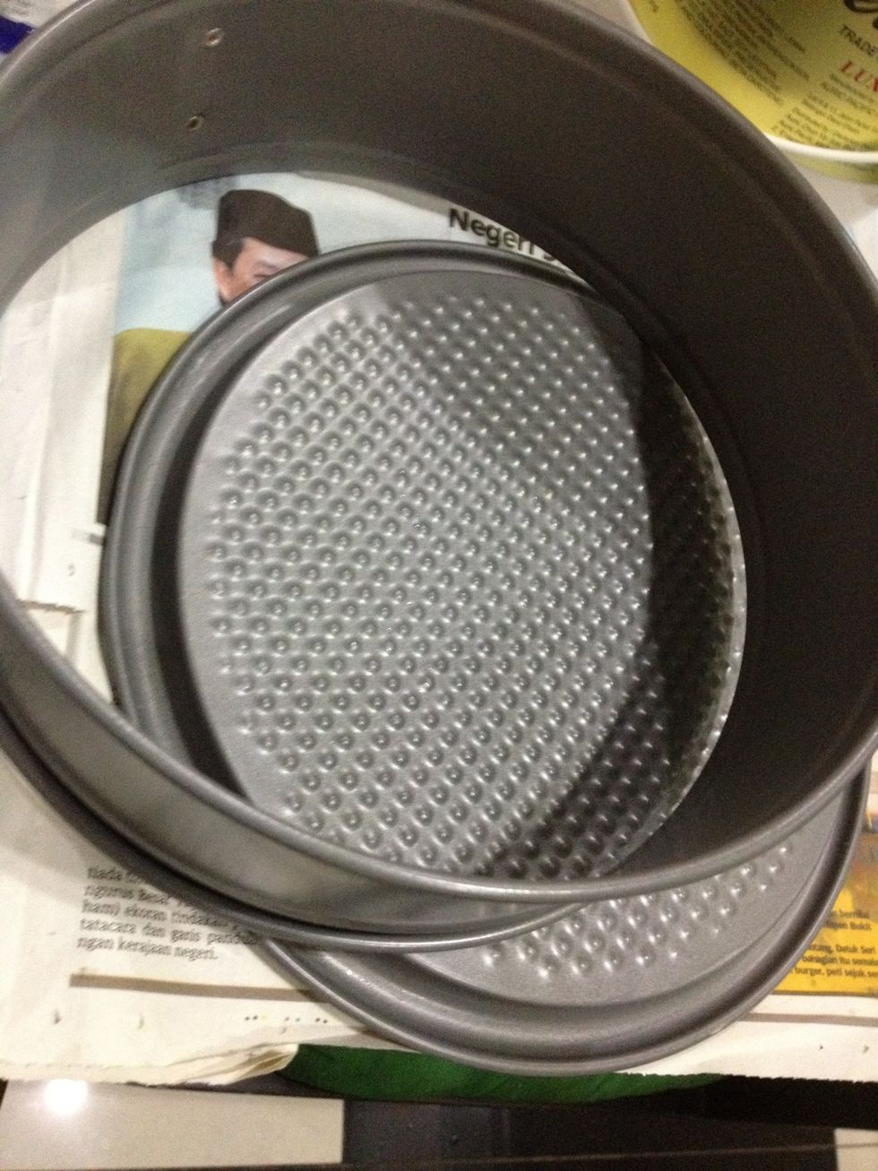 Get your spring formed pan. If you don't have this, you can use any other baking dish. Just line it with parchment paper, making sure they hang a little extra, so removal will be easier.