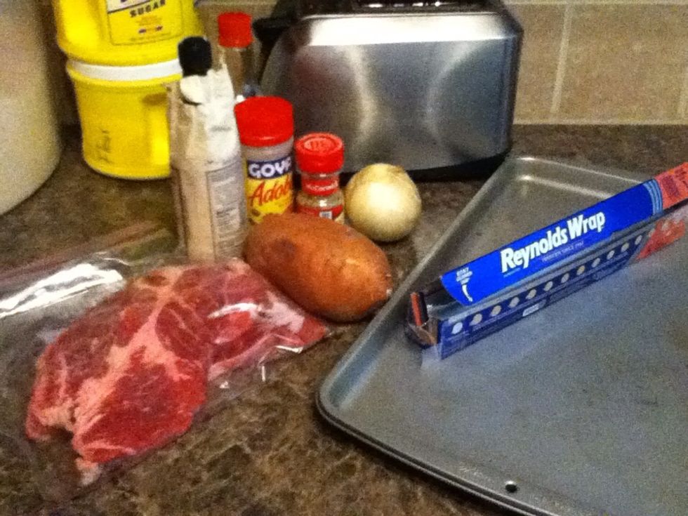 Get your stuff together, here I'm doing two packets with a roughly 12-16 oz steak in each. I'm also using a sheet pan in case the foil rips or leaks, it's optional. Preheat oven to 350 F.