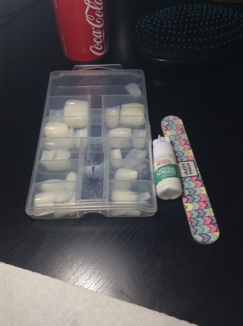 Get your supplies ready. The nail glue comes with the nail kit.