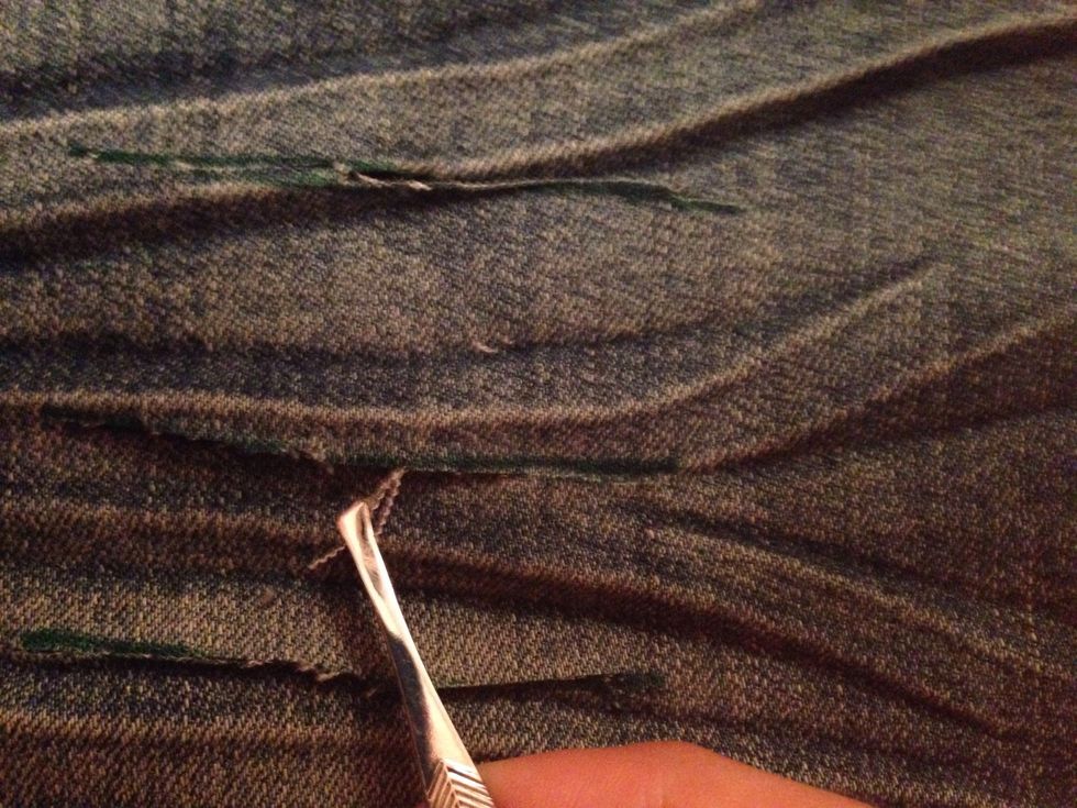Get your tweezers and start to pull some of the white threads