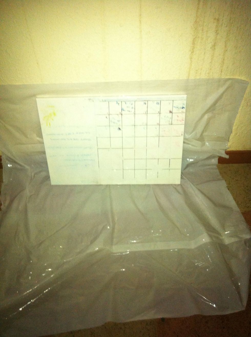 Get your white board cleaned and ready to be sprayed. Note: Cover the area around it so you don't mess up the place.